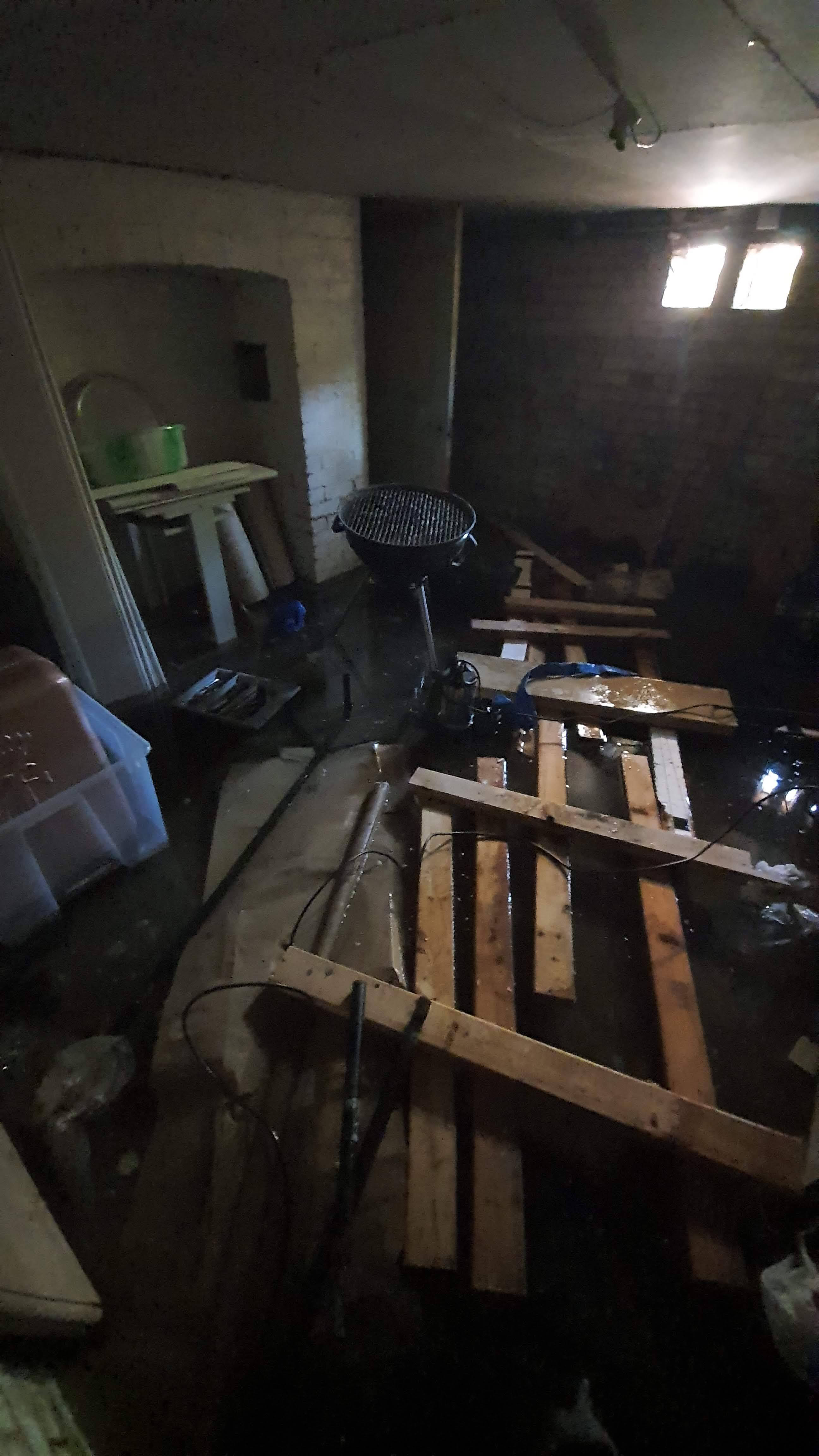 Flooded basement containing water damaged property