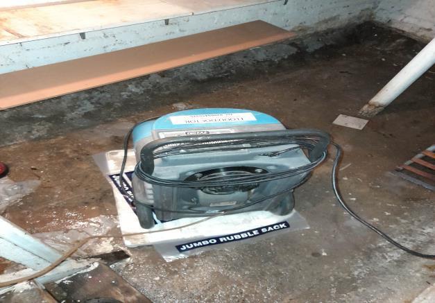 dehumidifier being used in flooded basement